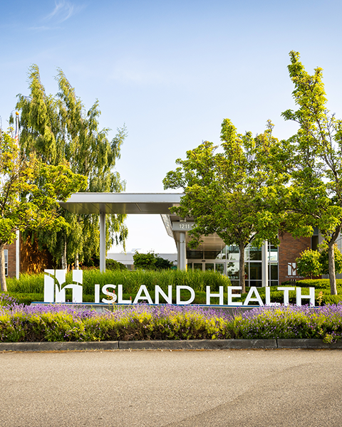 The outside of Island Health facility with signage